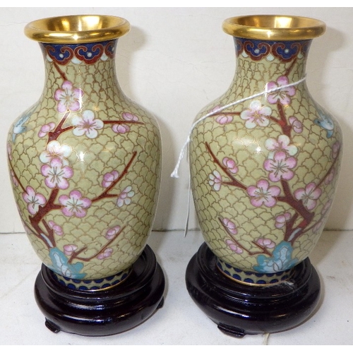 140 - A pair of cloisonné vases, a trinket box and two pin dishes