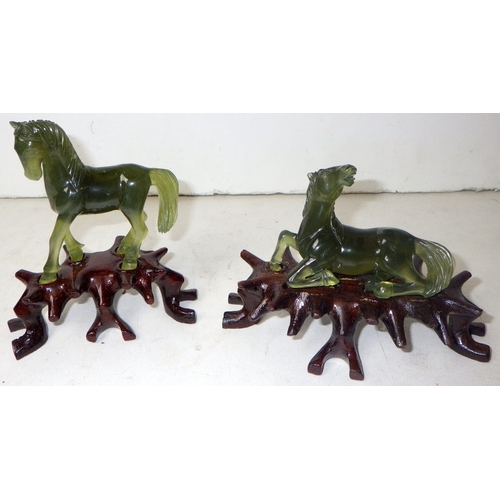 183 - A circa 1960s Chinese jade set of carved horses on wooden stands