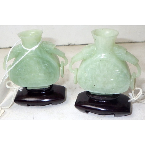 187 - Two circa 1960s / 1970s Chinese jade carved bottles on wood stands