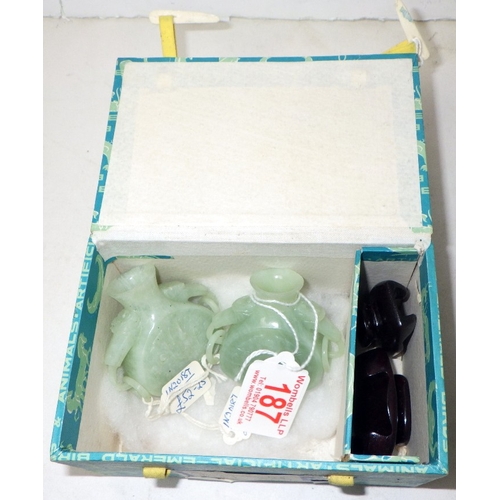 187 - Two circa 1960s / 1970s Chinese jade carved bottles on wood stands