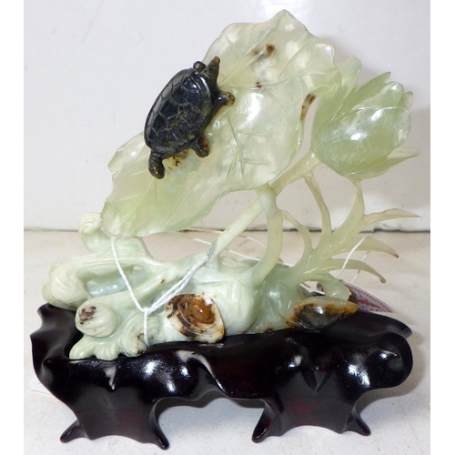 188 - A circa 1960s / 1970s Chinese jade carving depicting a turtle on foliage, presented on a wooden stan... 