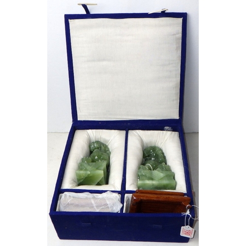 190 - A pair of circa 1960s / 1970s Chinese jade carved Dogs of Foo figures on wooden stands