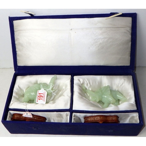 191 - A pair of circa 1960s / 1970s Chinese jade carved elephants on wooden stands