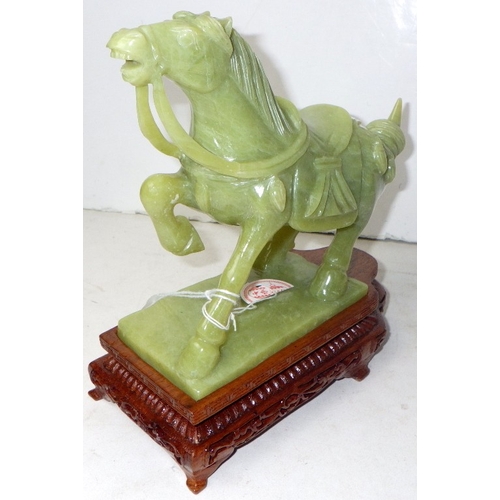 194 - A circa 1960s / 1970s Chinese jade carved horse on a wood stand