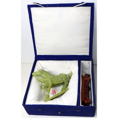 194 - A circa 1960s / 1970s Chinese jade carved horse on a wood stand