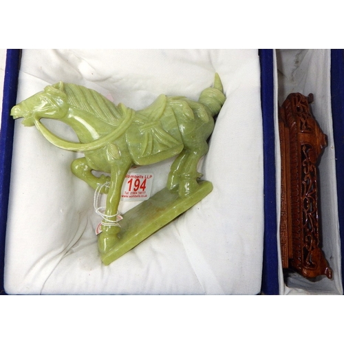 194 - A circa 1960s / 1970s Chinese jade carved horse on a wood stand