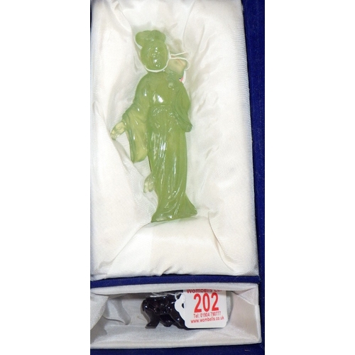 202 - A circa 1960s / 1970s Chinese jade carved figure of a woman on a wooden stand