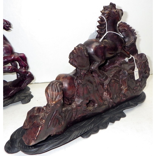 204 - An Oriental carved and polished stone horse sculpture