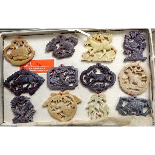 207 - Three boxes of Oriental carved and polished stone amulets (3)