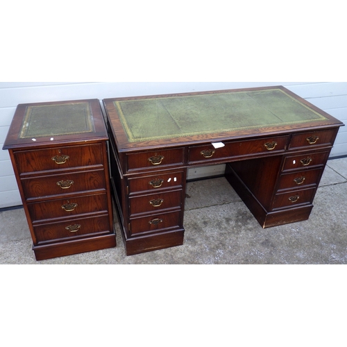 670 - A reproduction oak pedestal desk, 138cm wide with matching filing cabinet (2)