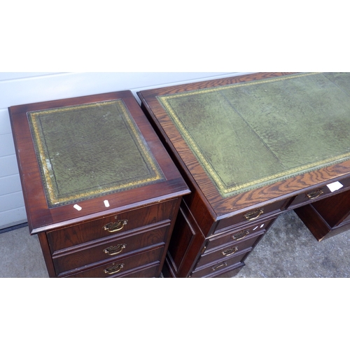 670 - A reproduction oak pedestal desk, 138cm wide with matching filing cabinet (2)