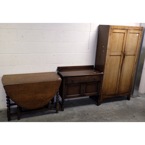 679 - An oak/ply gents wardrobe, low cupboard and a barleytwist gateleg table, marks (3)