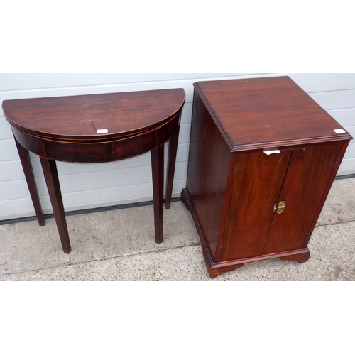696 - A mahogany demi-lune tea table together with a cupboard (2) (a/f)
