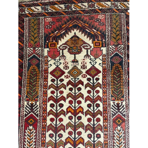 707 - A faded Tribal Balouch prayer style Geometric rug  100 x 190cm