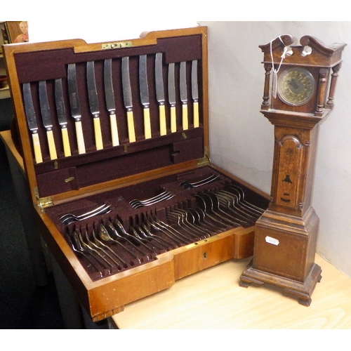 264 - A part canteen of cutlery together with a miniature longcase clock (2)