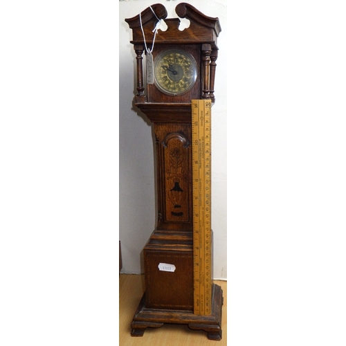 264 - A part canteen of cutlery together with a miniature longcase clock (2)