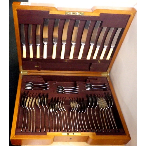 264 - A part canteen of cutlery together with a miniature longcase clock (2)