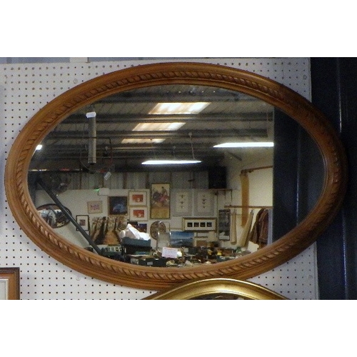 288 - A modern bevelled gilt mirror and a pine framed mirror (2)