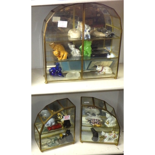 317 - A collection of Curio Cabinet Cats in display cases