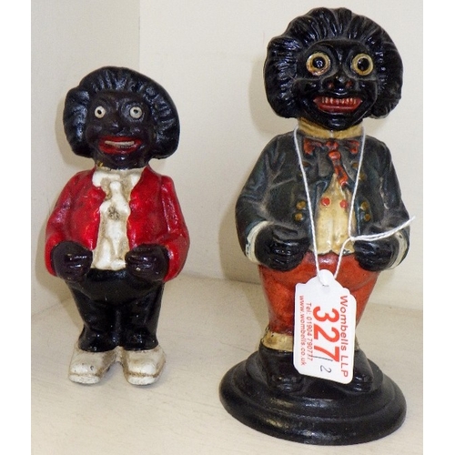 327 - Two cast iron Golly money boxes, 14 & 17cm tall