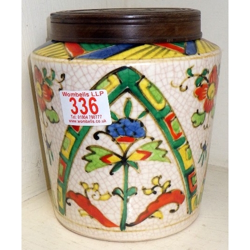 336 - A Japanese floral crackle glaze lidded jar 16cm tall