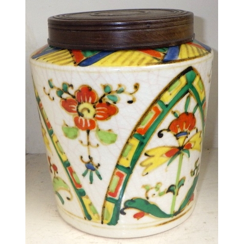336 - A Japanese floral crackle glaze lidded jar 16cm tall