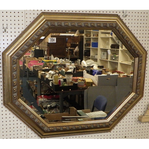 353 - A bevelled mirror, 83cm wide