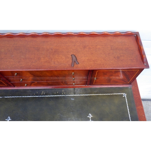 716 - A reproduction mahogany lady's writing table, marks, 92cm wide