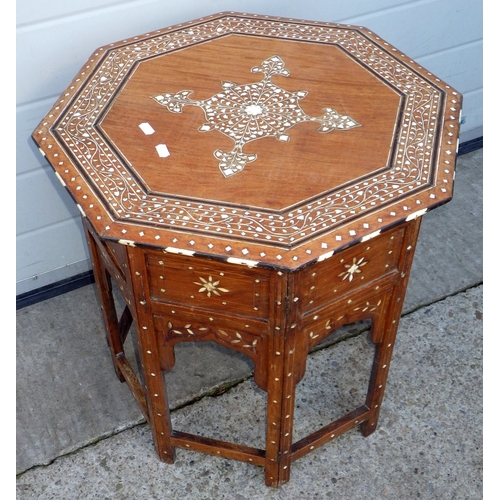 725 - An octagonal bone inlaid folding occasional table, 56cm wide