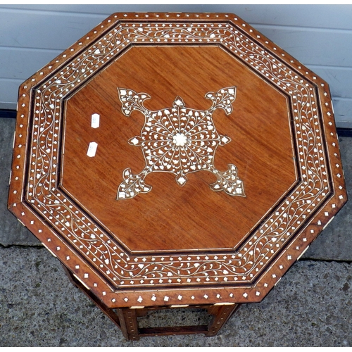 725 - An octagonal bone inlaid folding occasional table, 56cm wide