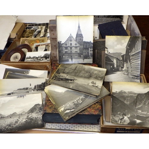 401 - A large qty of vintage photographs and postcards