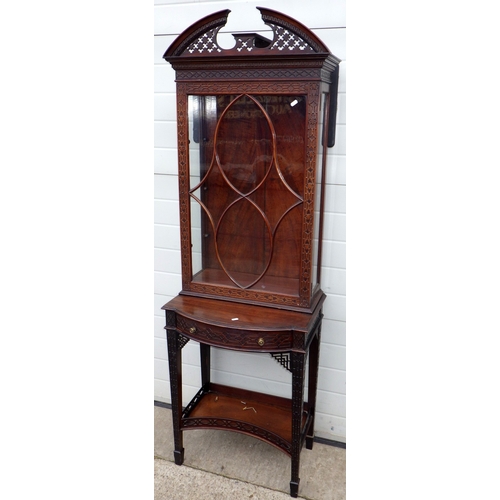 753 - An Edwardian Chippendale style fretwork decorated narrow cabinet on stand, 190cm tall, 61cm wide