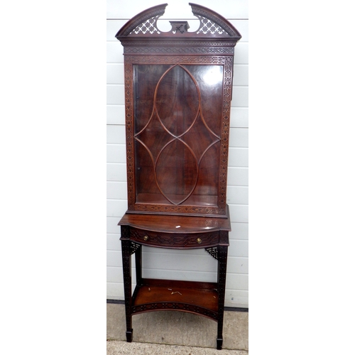 753 - An Edwardian Chippendale style fretwork decorated narrow cabinet on stand, 190cm tall, 61cm wide