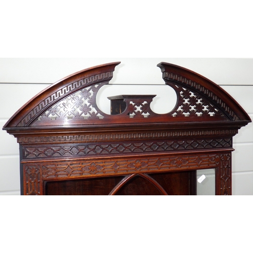 753 - An Edwardian Chippendale style fretwork decorated narrow cabinet on stand, 190cm tall, 61cm wide