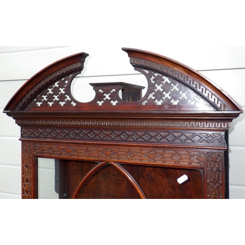 753 - An Edwardian Chippendale style fretwork decorated narrow cabinet on stand, 190cm tall, 61cm wide