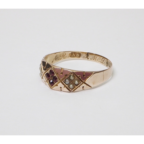 29 - A late Victorian 9ct gold Gothic Revival taste ring set with eight seed pearls and four rubies in th... 