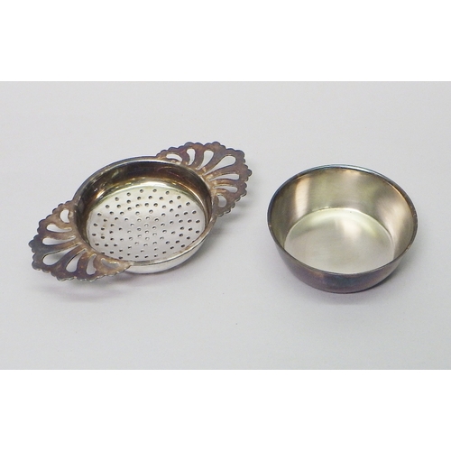 5 - A silver tea strainer and stand, Royal Irish Silver Co with Mappin & Web retailer stamp, Sheffield 1... 