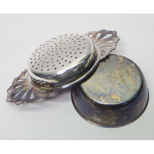 5 - A silver tea strainer and stand, Royal Irish Silver Co with Mappin & Web retailer stamp, Sheffield 1... 