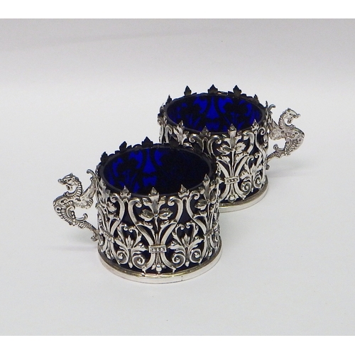 6 - Silver condiments: a pair of repousse pepper pots; a pair of octagonal pepper pots having loaded bas... 