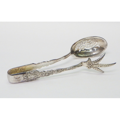 7 - An Edwardian serving tongs, white metal marked Sterling.  165mm long.  The tongs weigh 72g - please ... 