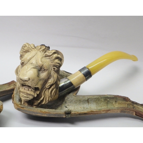 8 - A silver cigarette case, 70g; a meerschaum pipe carved with a lion head mask; a trinket box, white m... 