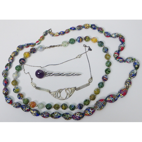 37 - A John Fraser Inverness Celtic knotwork motif kilt pin, silver and purple quartz, Edinburgh 1983, 88... 