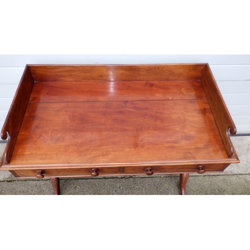 604 - A Victorian mahogany washstand with gallery back, top split, 106cm wide
