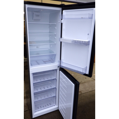 609 - A grey Beko fridge freezer, 183cm tall