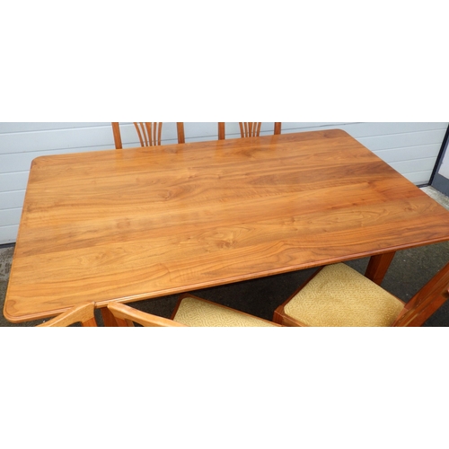 610 - A PETER 'DINKY' DAYNES DOLPHIN MAN (EX MOUSEMAN) WALNUT DINING TABLE, 183cm x 108cm  & 6 CHAIRS CARV... 