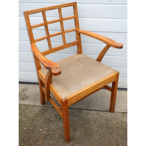 614 - An oak Arts & Crafts elbow chair, with lattice back