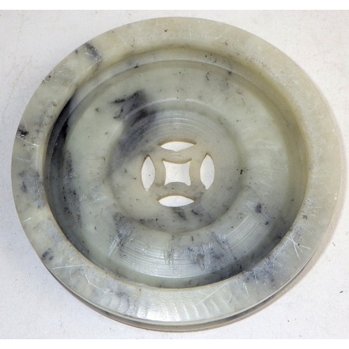 129 - An Oriental carved and polished stone base together with a pair of Oriental glass bonsai trees in te... 