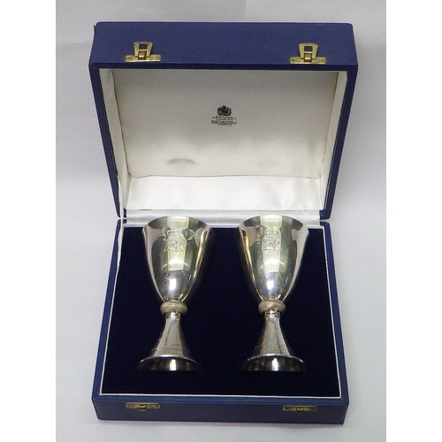 13 - A pair of Mappin & Webb Elizabeth II Royal Silver Wedding silver goblets designed by Colin Hillier, ... 