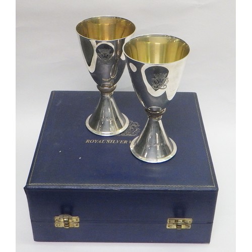 13 - A pair of Mappin & Webb Elizabeth II Royal Silver Wedding silver goblets designed by Colin Hillier, ... 
