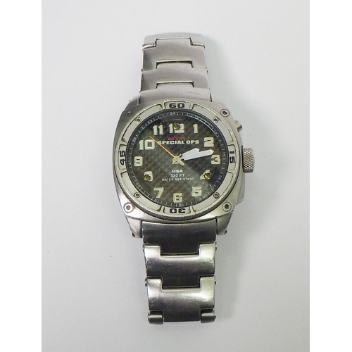60 - A MTM Special Ops quartz military style bracelet watch, stainless steel with a carbon fibre dial.  4... 